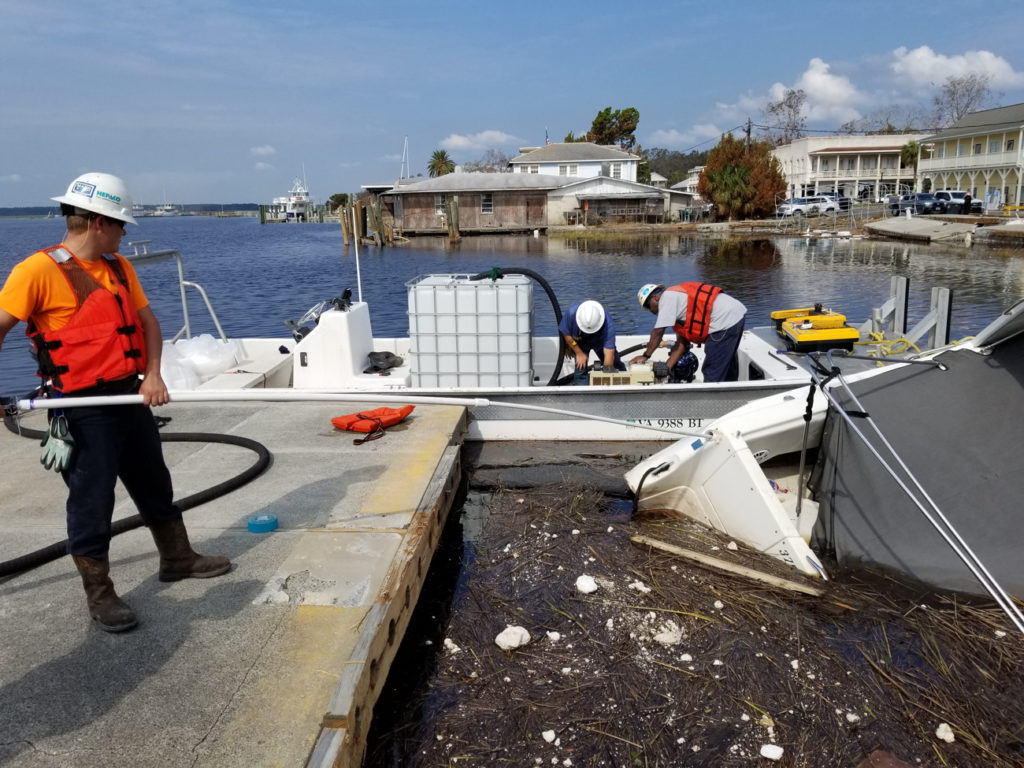 Storm cleanup at a damaged marina.